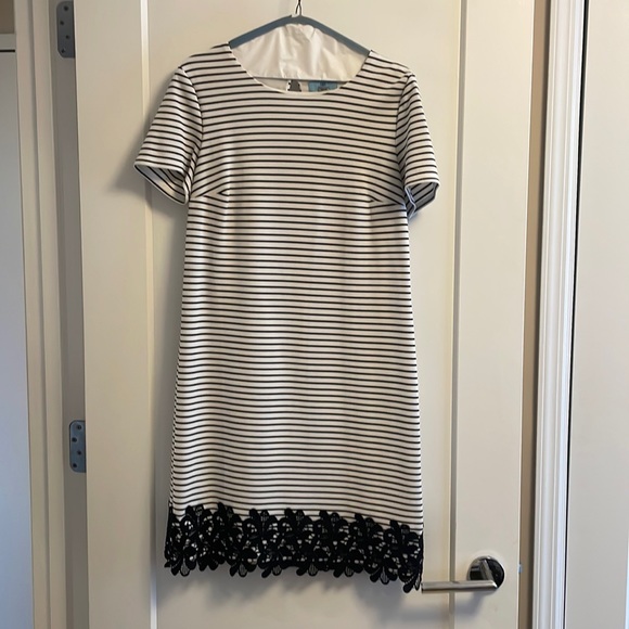 Black and white striped short sleeved dress with black lace on the bottom - Picture 1 of 6
